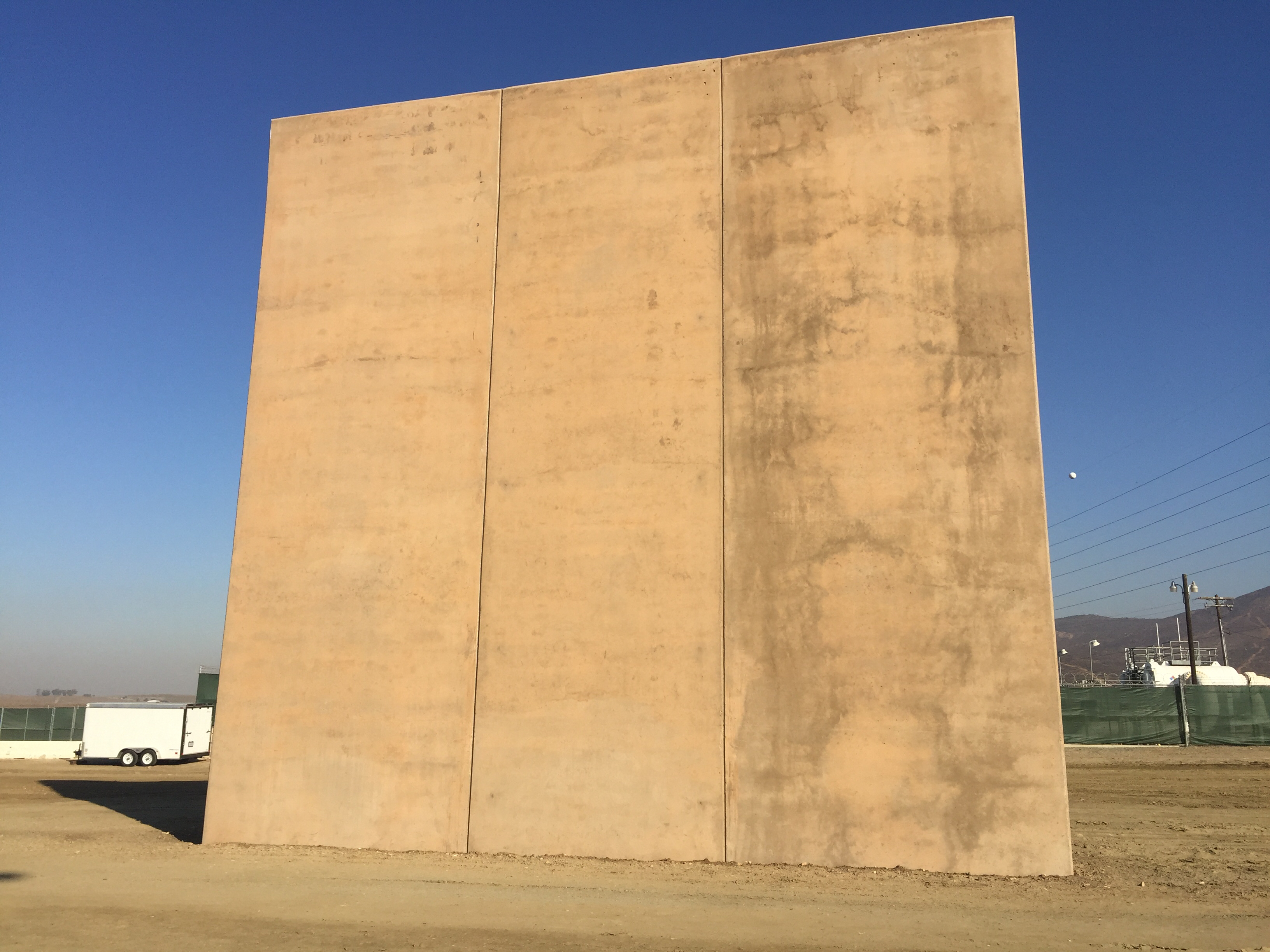A border wall prototype stands by the U.S.-Mexico border, Oct. 26, 2017. <em>(Elma Gonzalez/KPBS)</em>